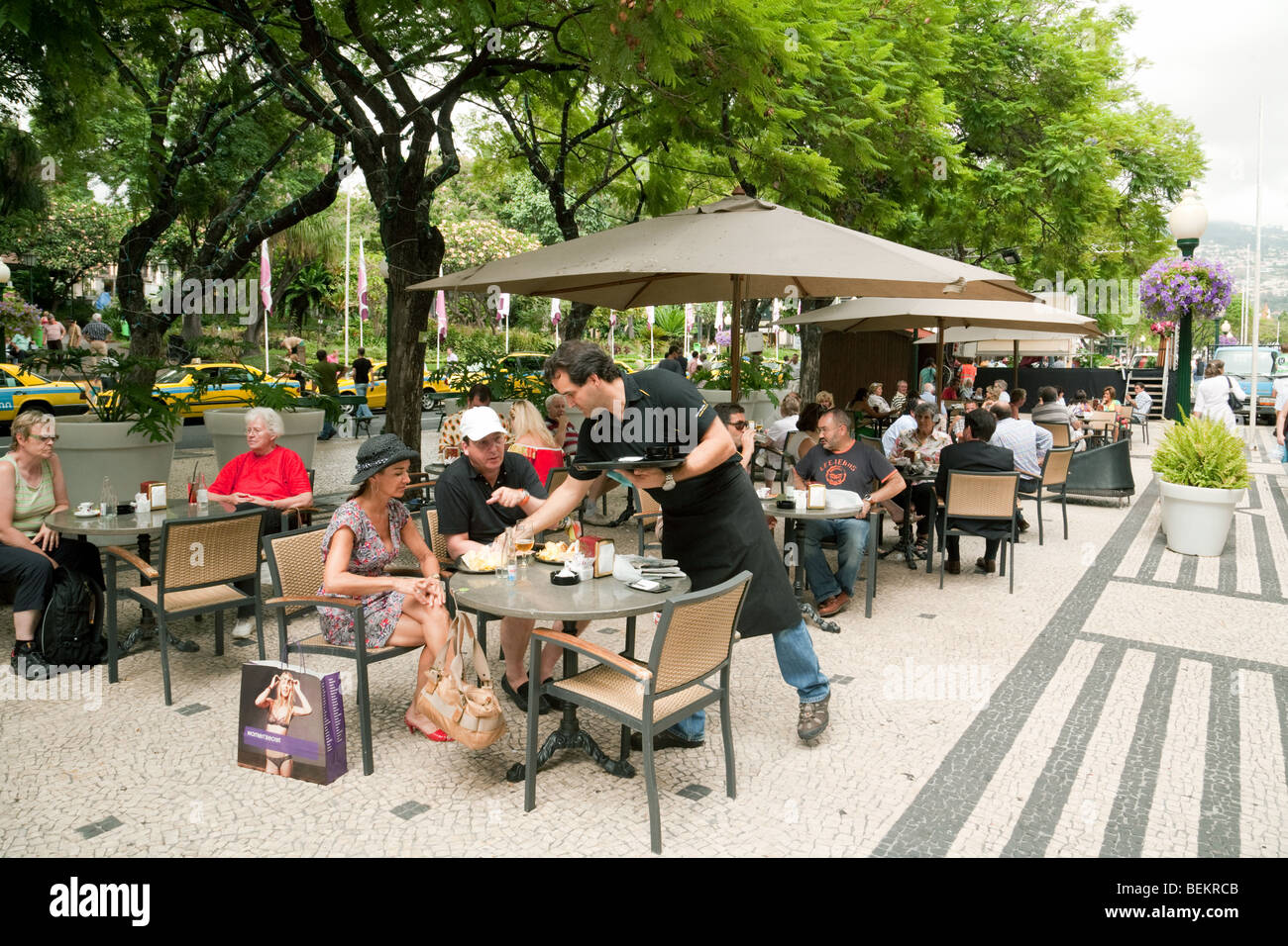 People relaxing in street cafes, Funchal, Madeira Stock Photo