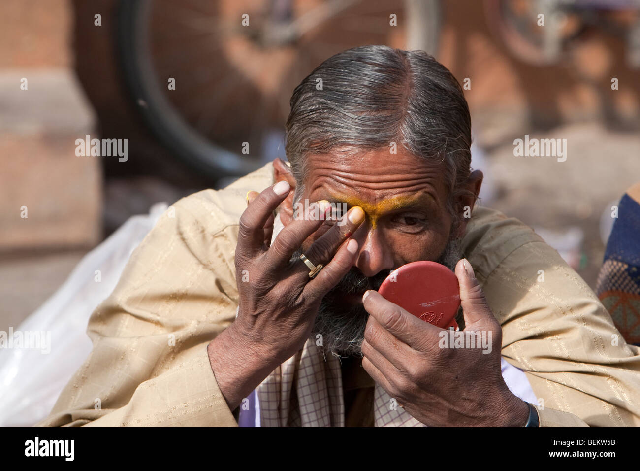 Pashupatinath, Nepal. Worshipper at Nepal's Holiest Hindu Temple Looking in Mirror as he