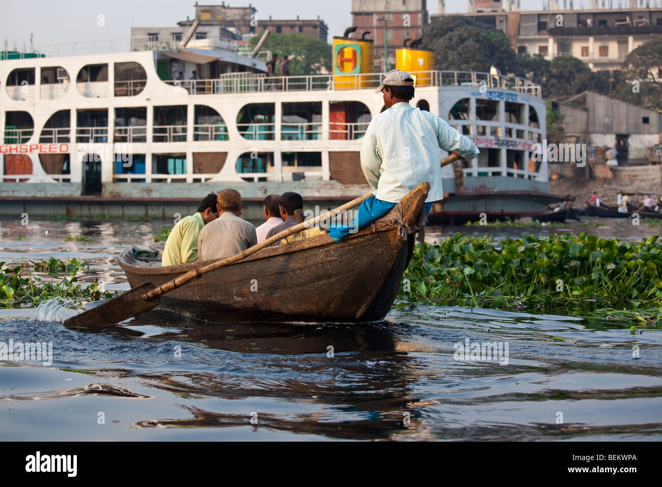 Dingi Nouka or small rowboat taxis on the Buriganga River in Dhaka Bangladesh Stock Photo