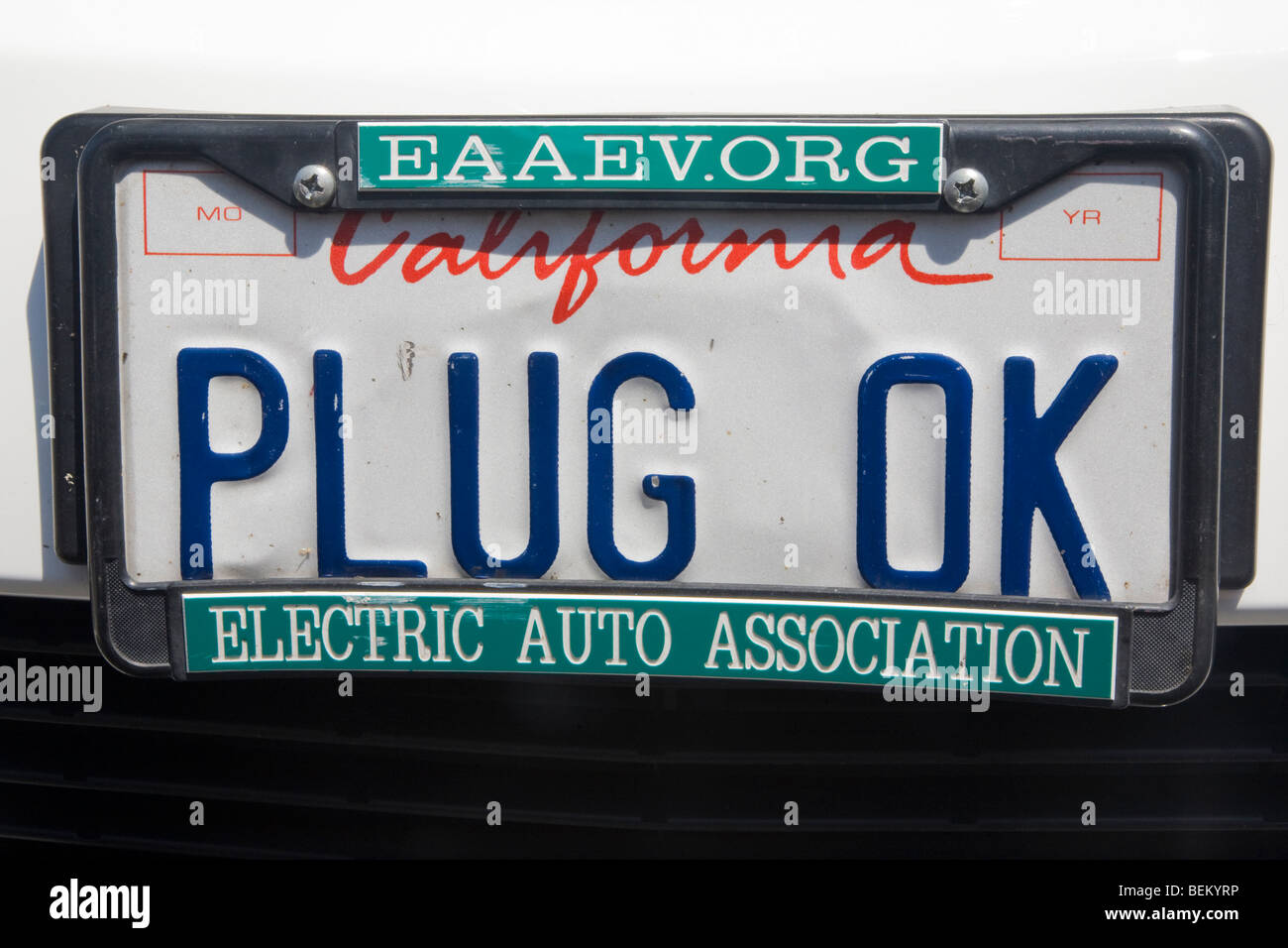 Closeup of 'PLUG OK' license plate on a Toyota Prius. Palo Alto, California, USA Stock Photo