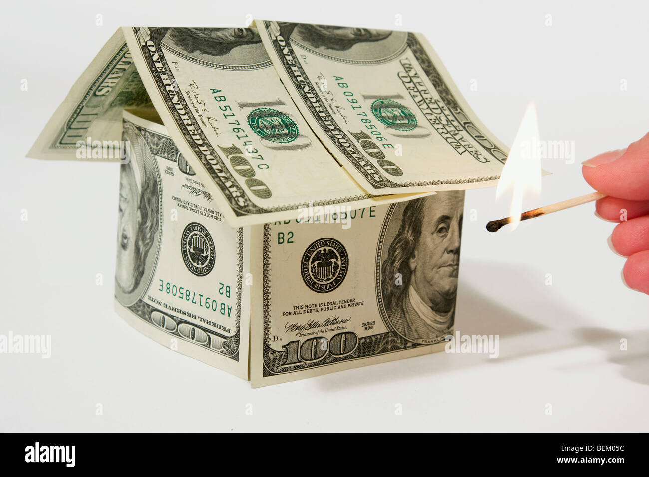 Money house made from dollars isolated on gray background Stock Photo