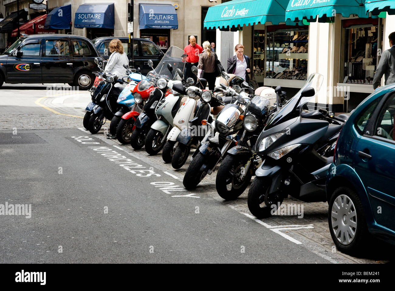 Motorcycles parked in a bay in street in Hatton Garden Stock Photo