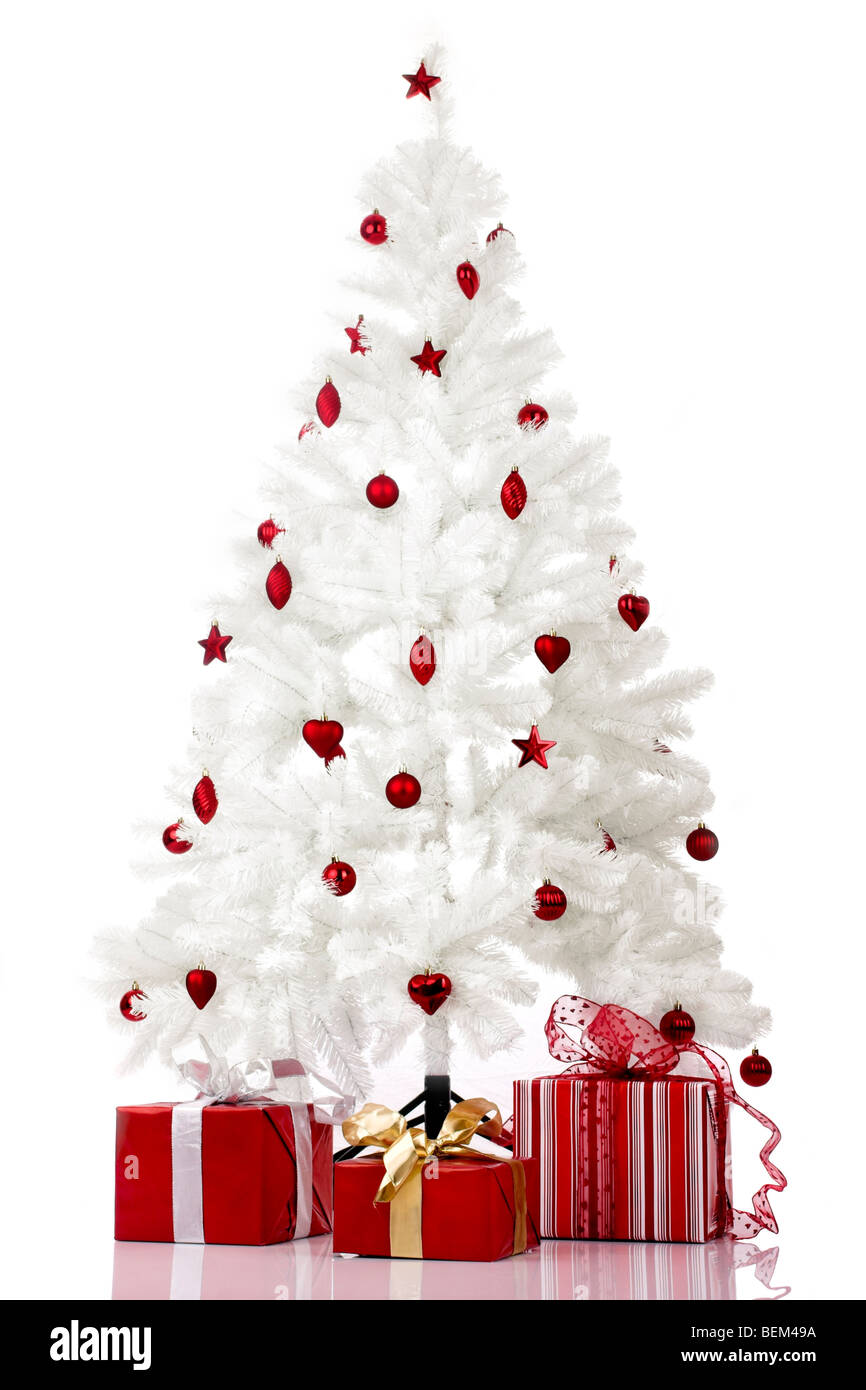 Christmas white tree and gifts over a white background Stock Photo - Alamy