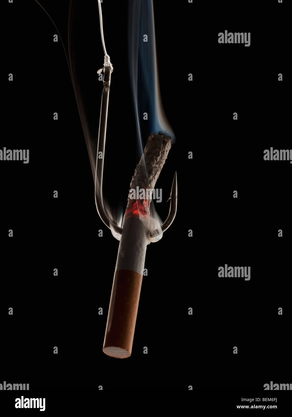 Cigarette with fishing hook Stock Photo