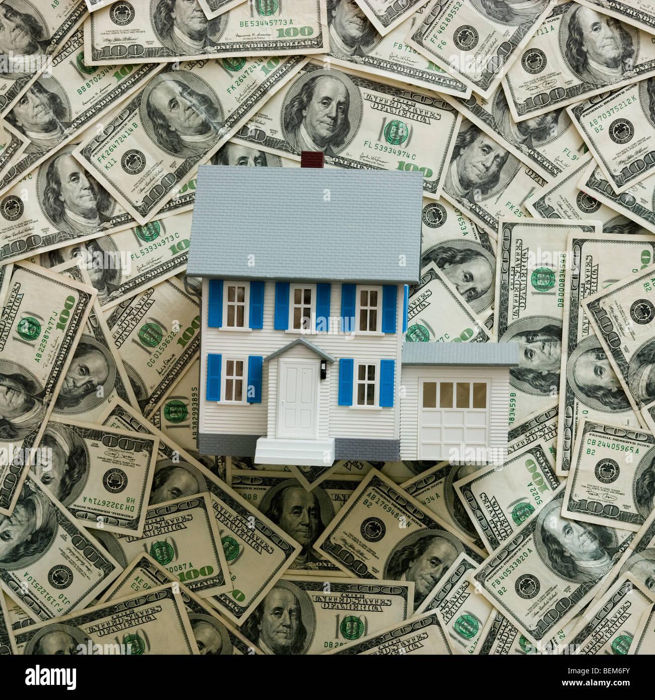 Symbolic house wtih US dollars as background Stock Photo