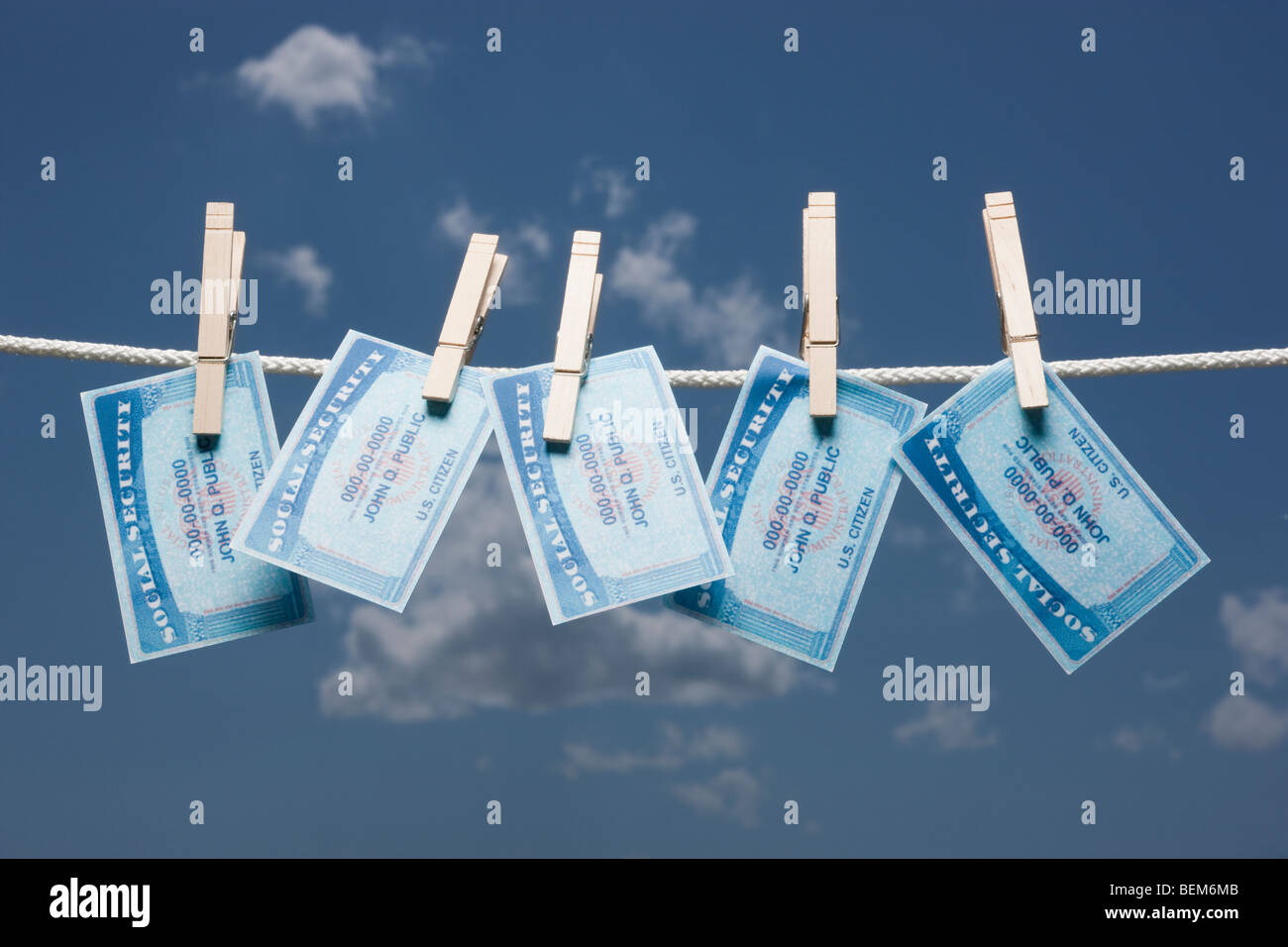 Social security cards on clothes line Stock Photo