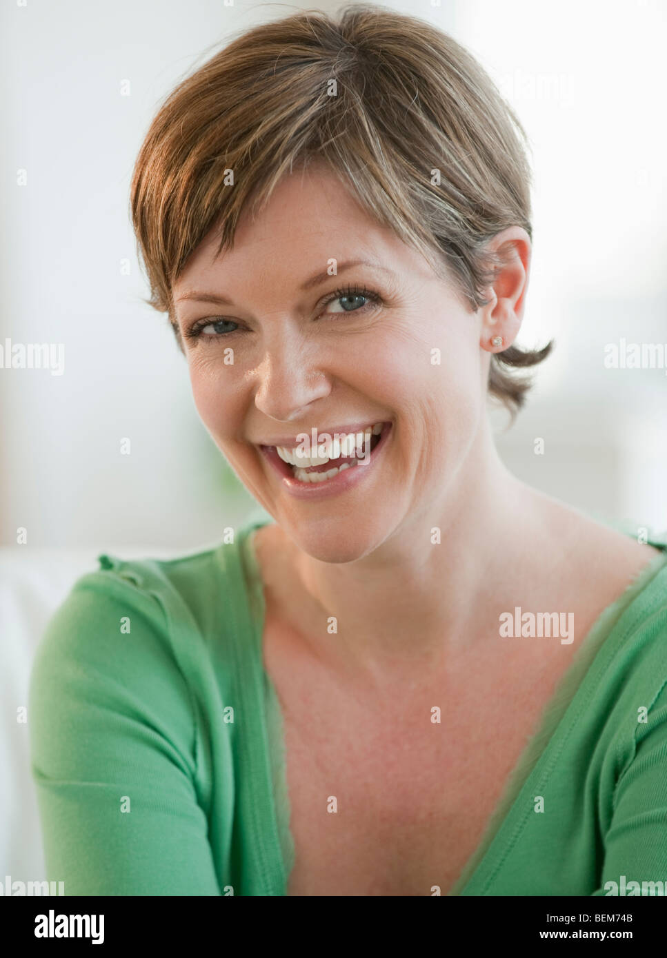Mature woman laughing housework hi-res stock photography and images - Alamy