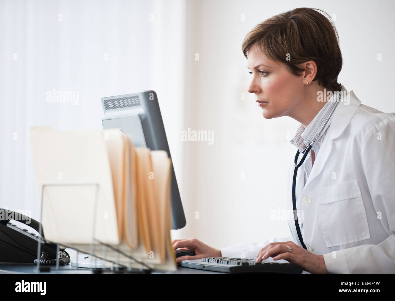 Woman working on computer Stock Photo