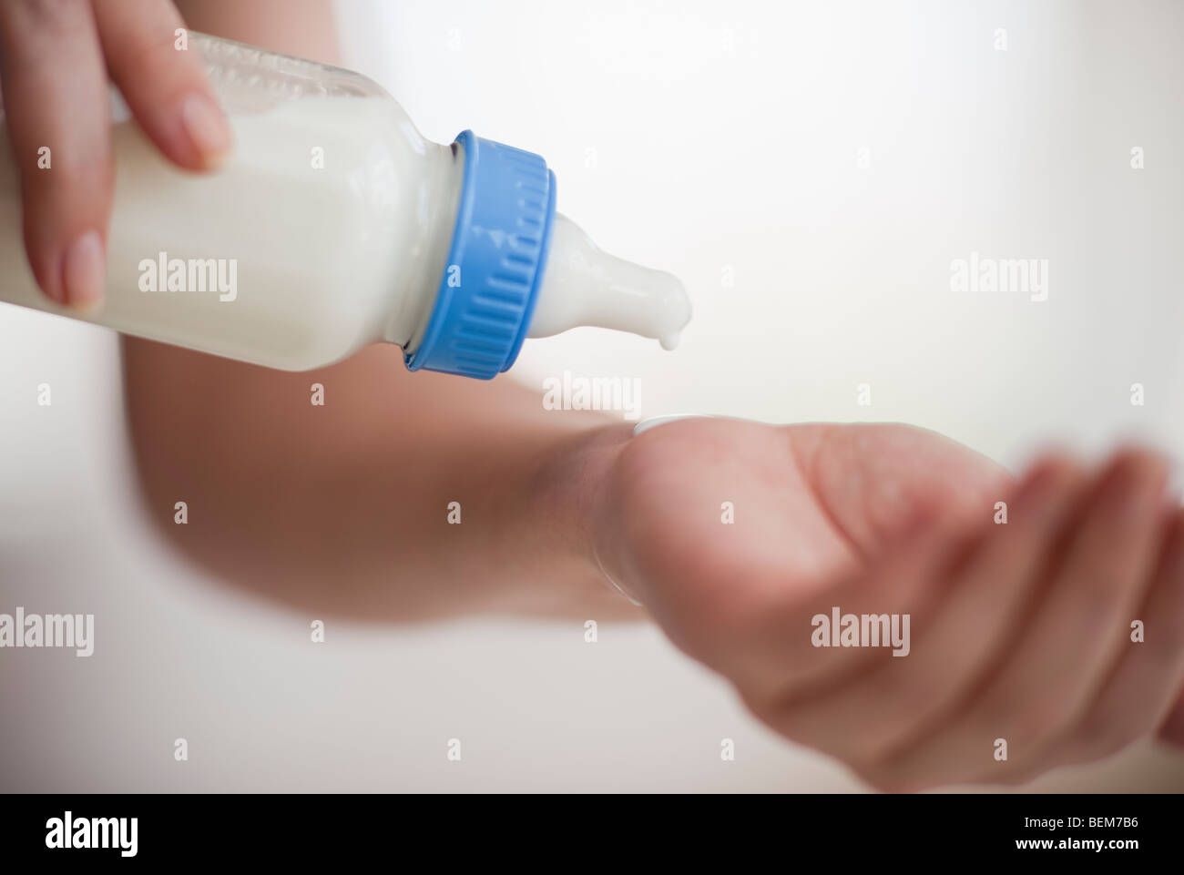Hands holding baby bottle Stock Photo Alamy