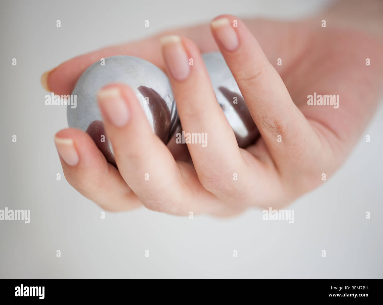 Hand holding Chinese balls Stock Photo - Alamy