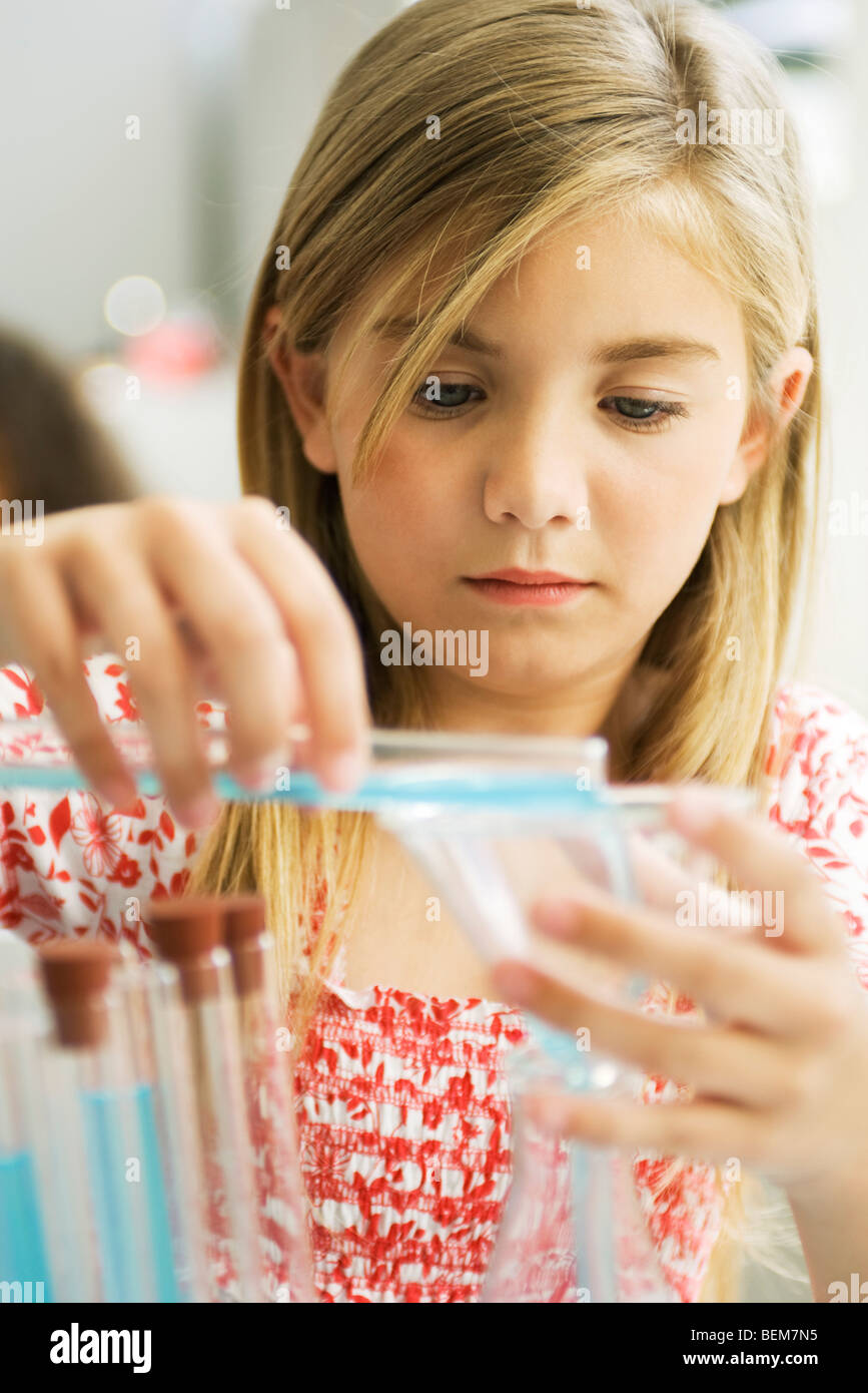Elementary student conducting science experiment Stock Photo Alamy