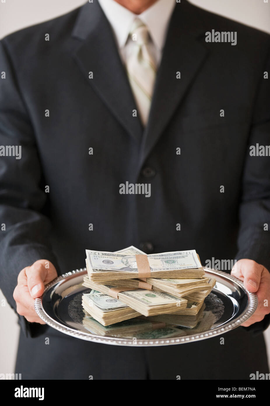 Money on silver platter Stock Photo Alamy