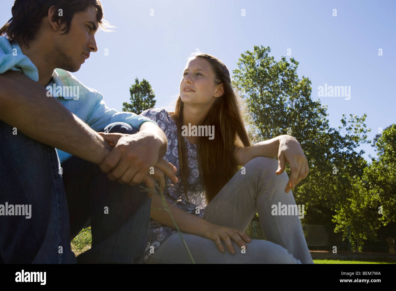 Young couple talking together outdoors Stock Photo