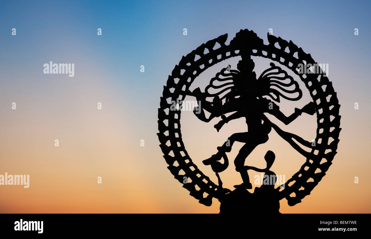 Dancing lord Shiva statue, Nataraja silhouette, at dawn in India Stock Photo