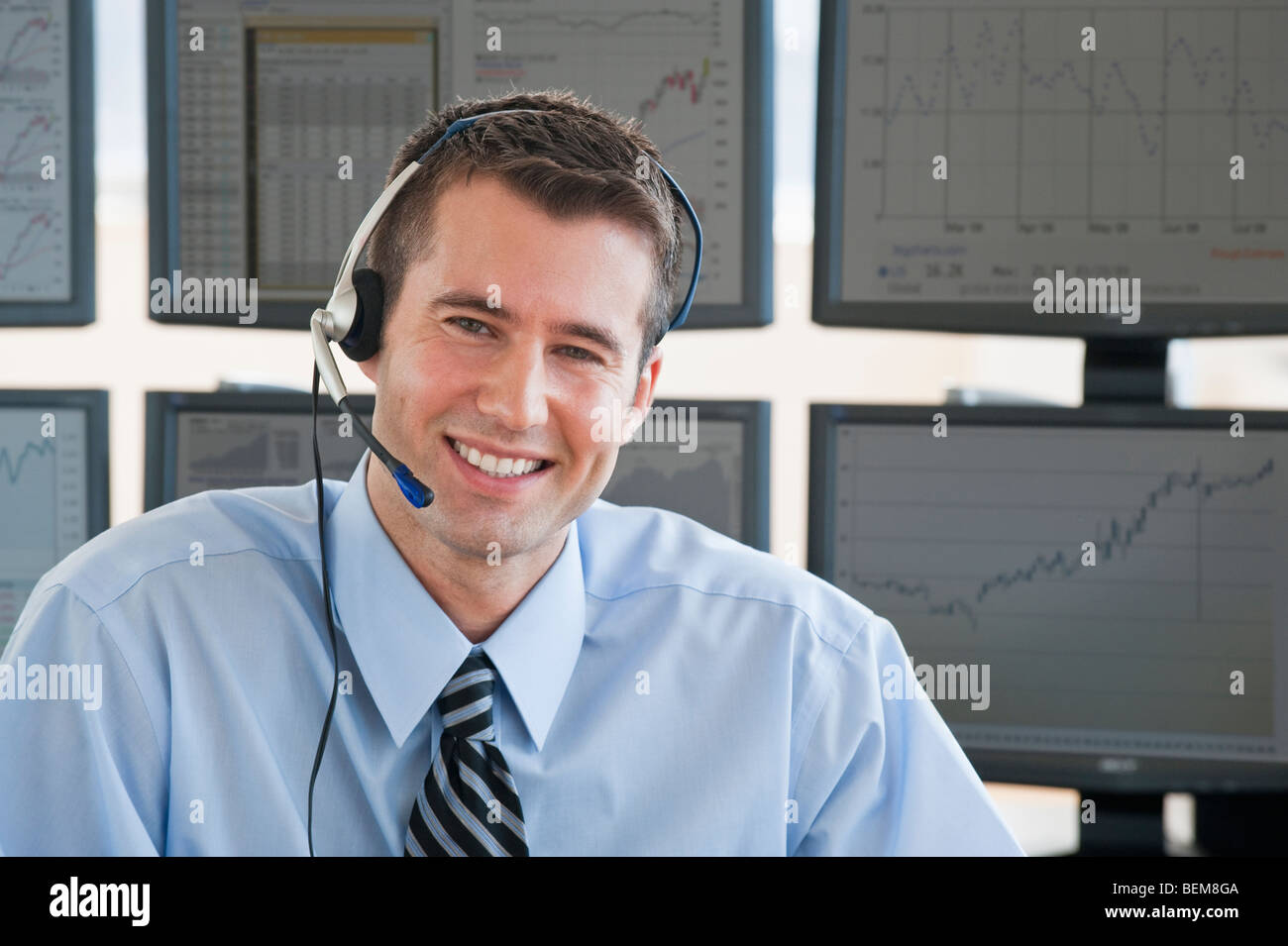Male trader with headset Stock Photo
