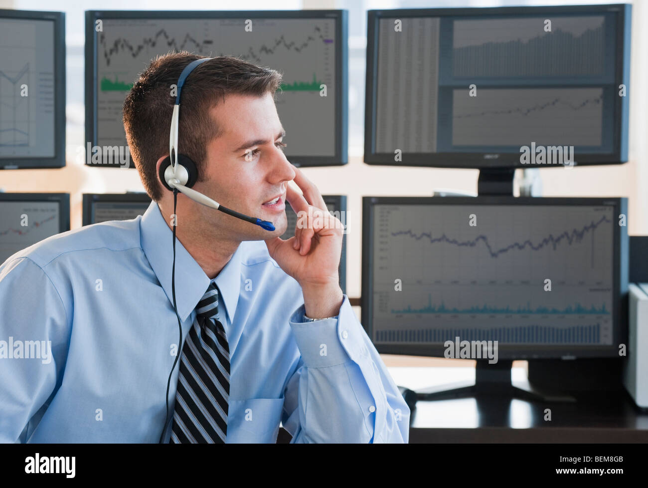 Male trader with headset Stock Photo