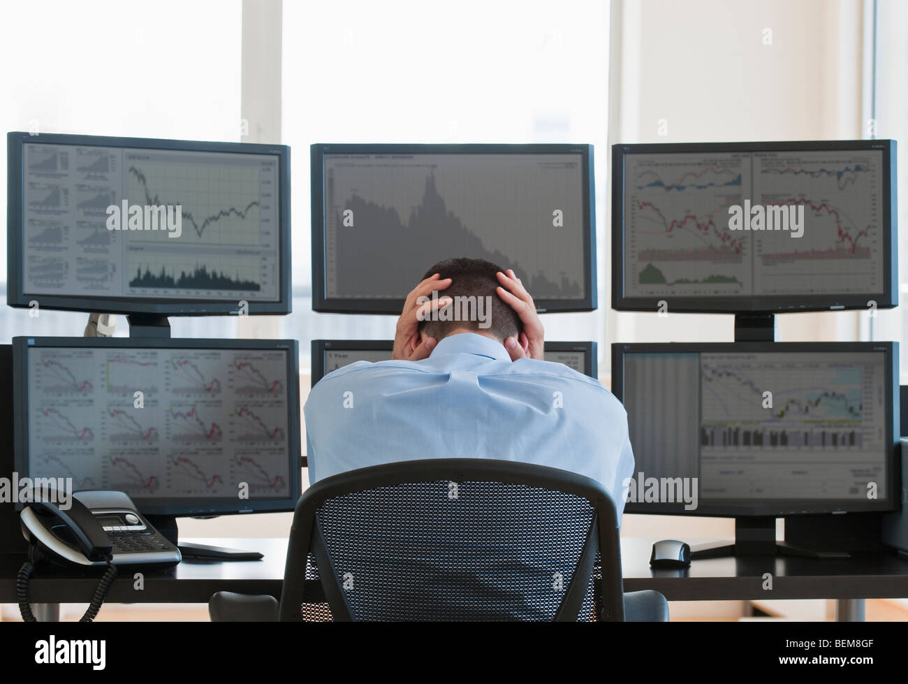 Frustrated male trader at work Stock Photo