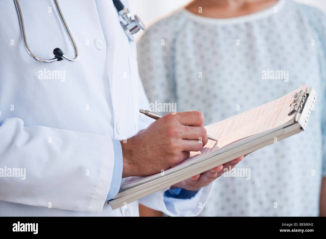 Doctor studying patient chart Stock Photo