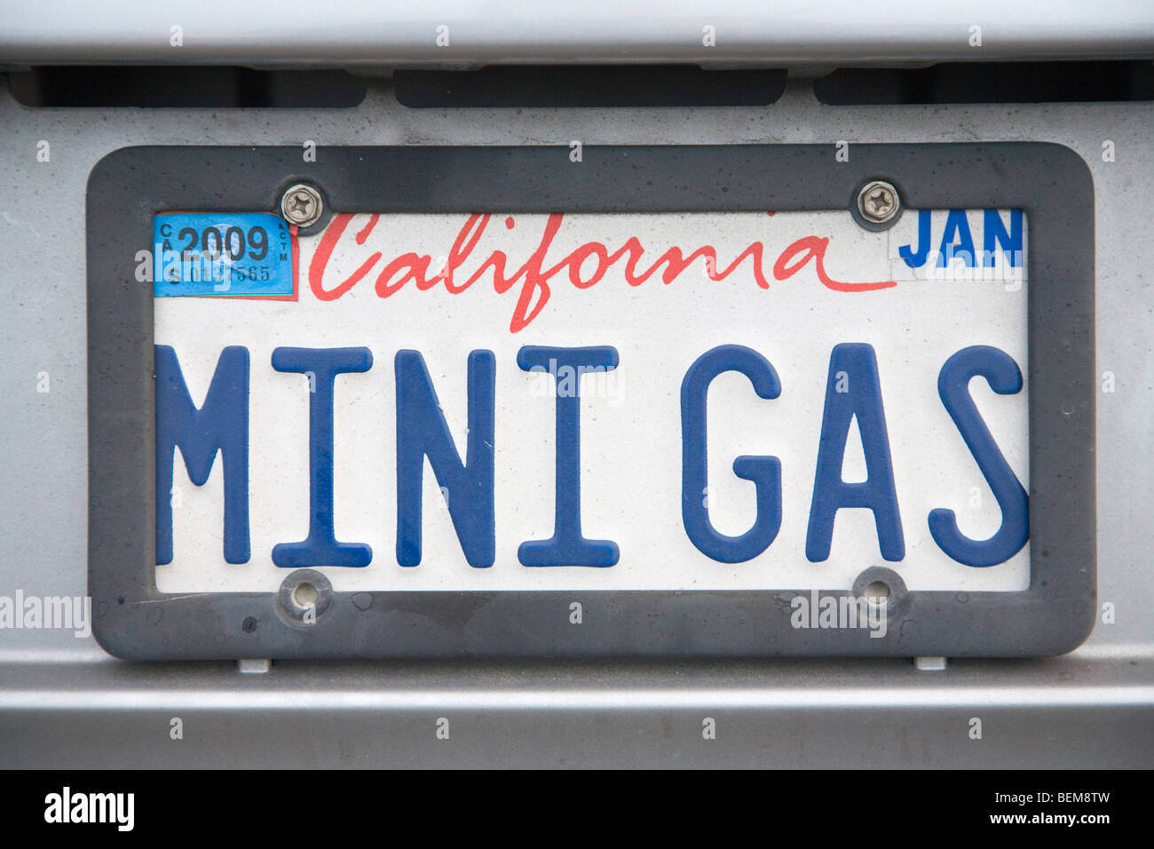 A close up of a 'MINI GAS'Mini Gas' license plate on Honda Insight hybrid car. Palo Alto, California, USA Stock Photo
