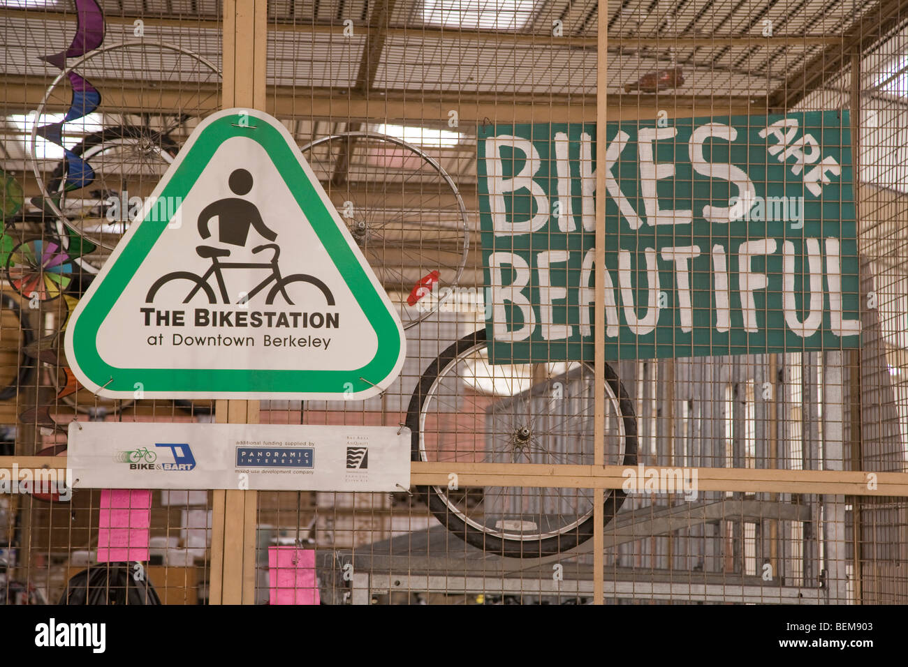 Bikes Are Beautiful and bikestation signs at a bicycle storage at the Downtown Berkeley BART station. Berkeley, California, USA Stock Photo