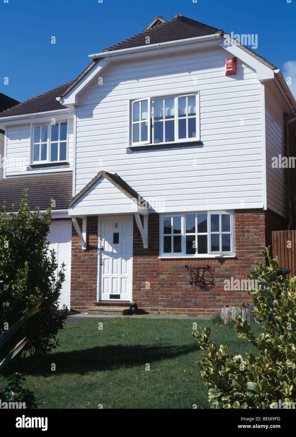 Traditional white clapboard and brick house Stock Photo Alamy