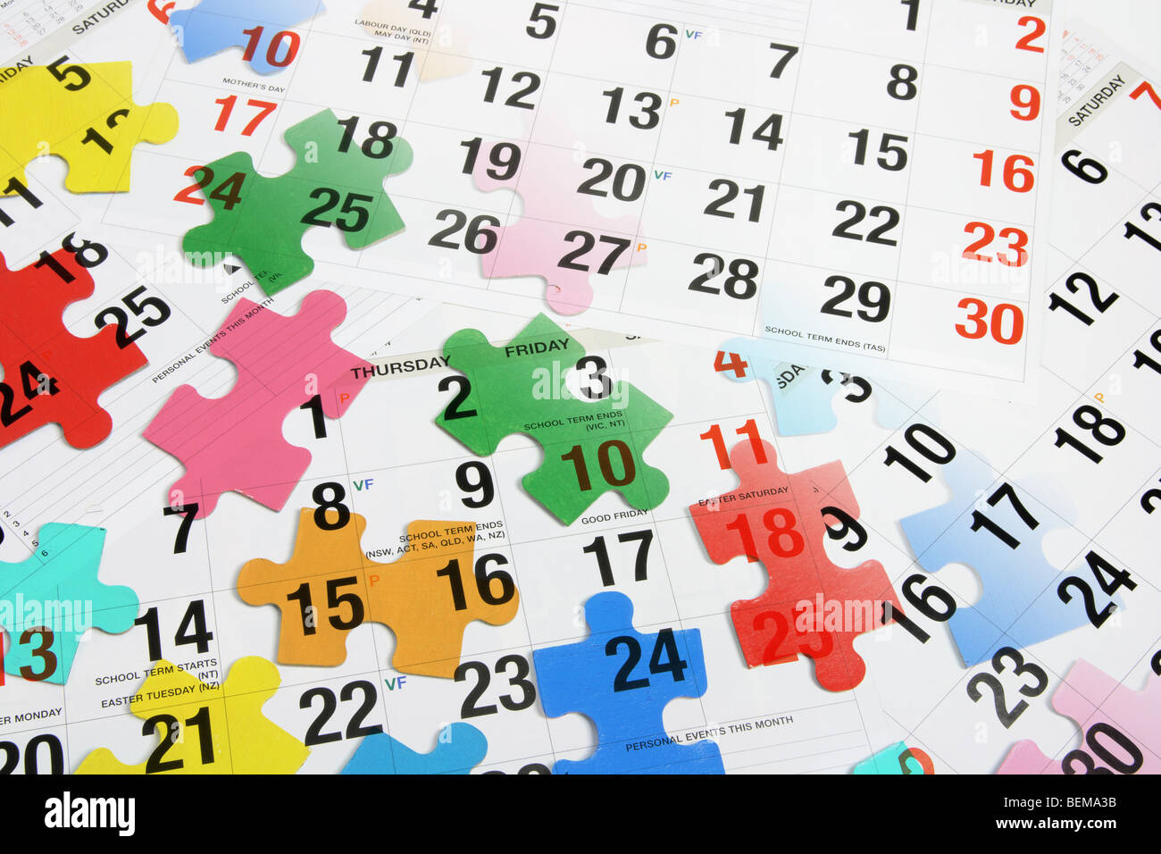 Calendar and Jigsaw Puzzle Pieces Stock Photo
