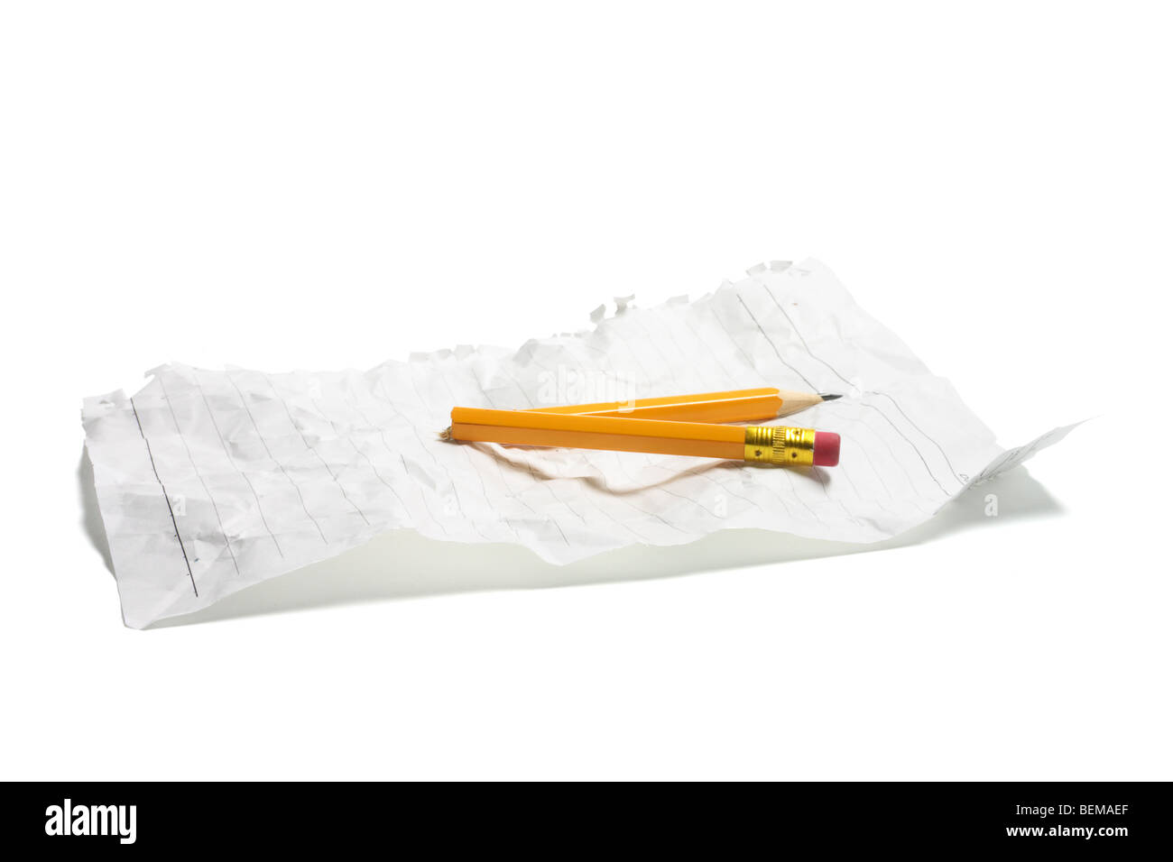 Broken Pencil and Crumpled Paper Stock Photo