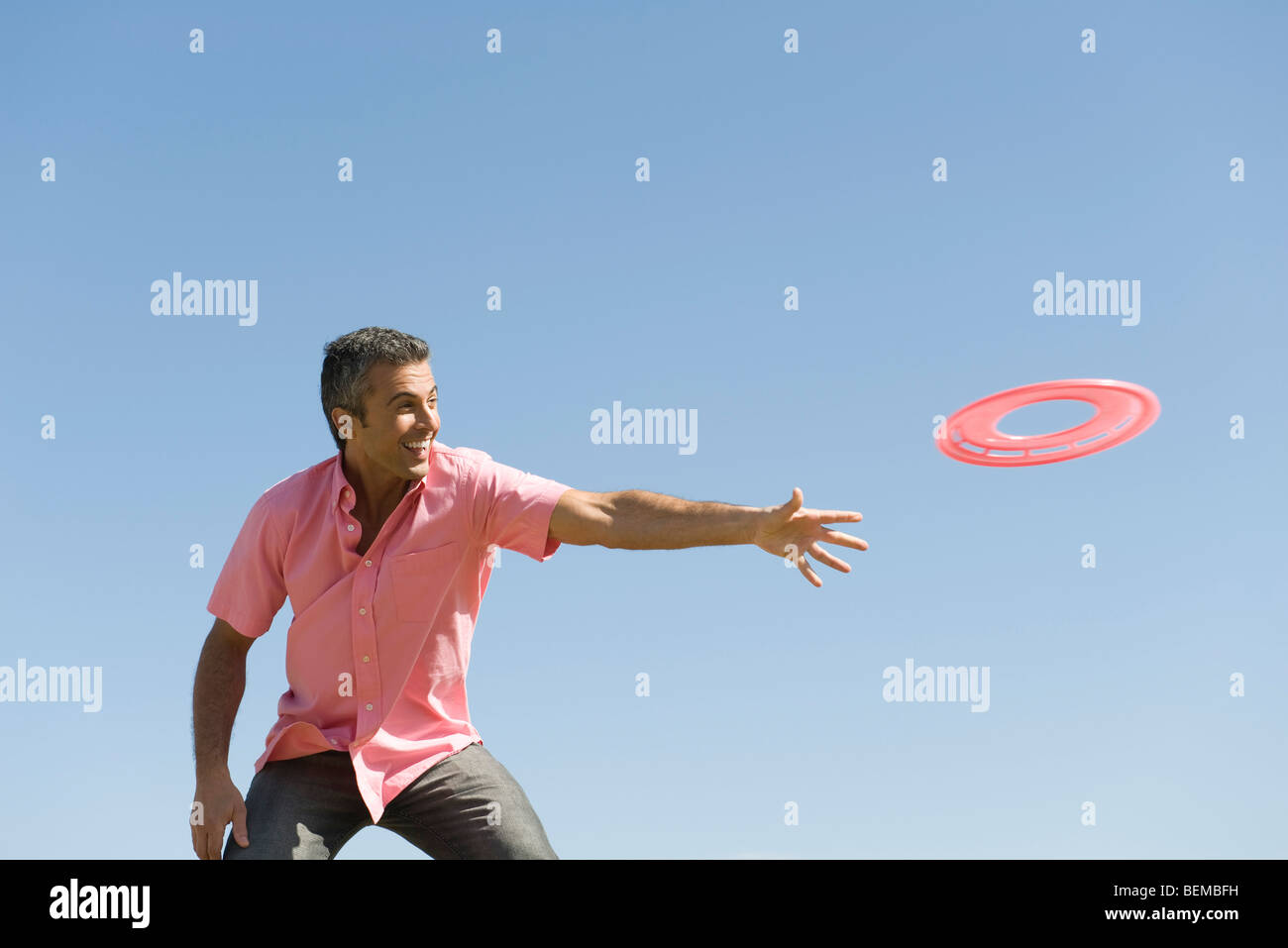 Man throwing flying disc Stock Photo