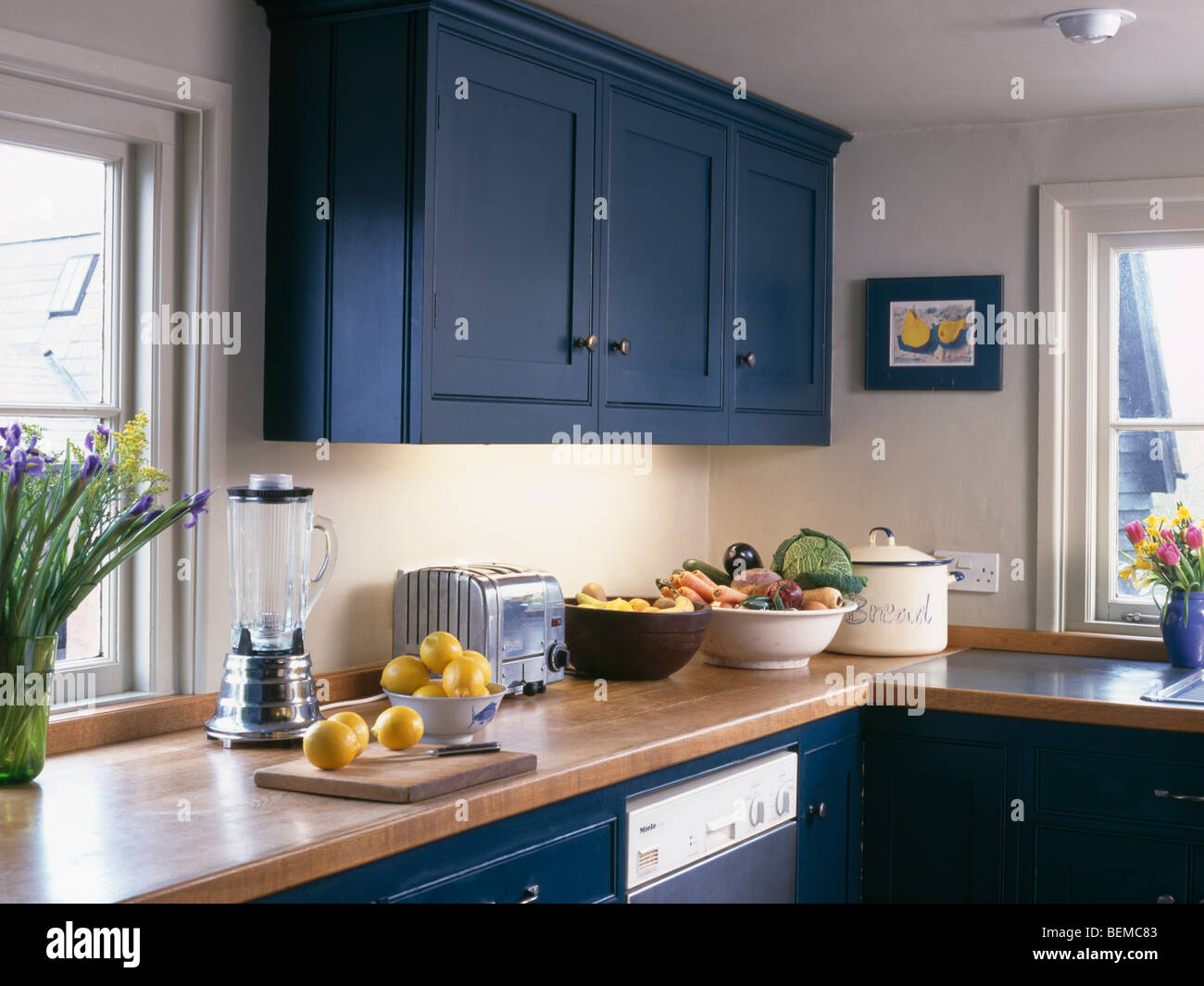 Blue Fitted Cupboard Above Wooden Worktop With Electric Blender And Stock Photo Alamy