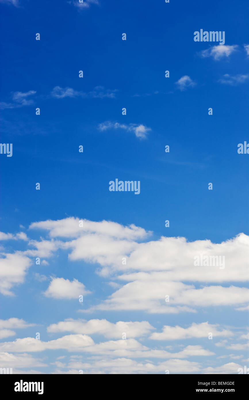 blue sky with white fluffy clouds background Stock Photo - Alamy