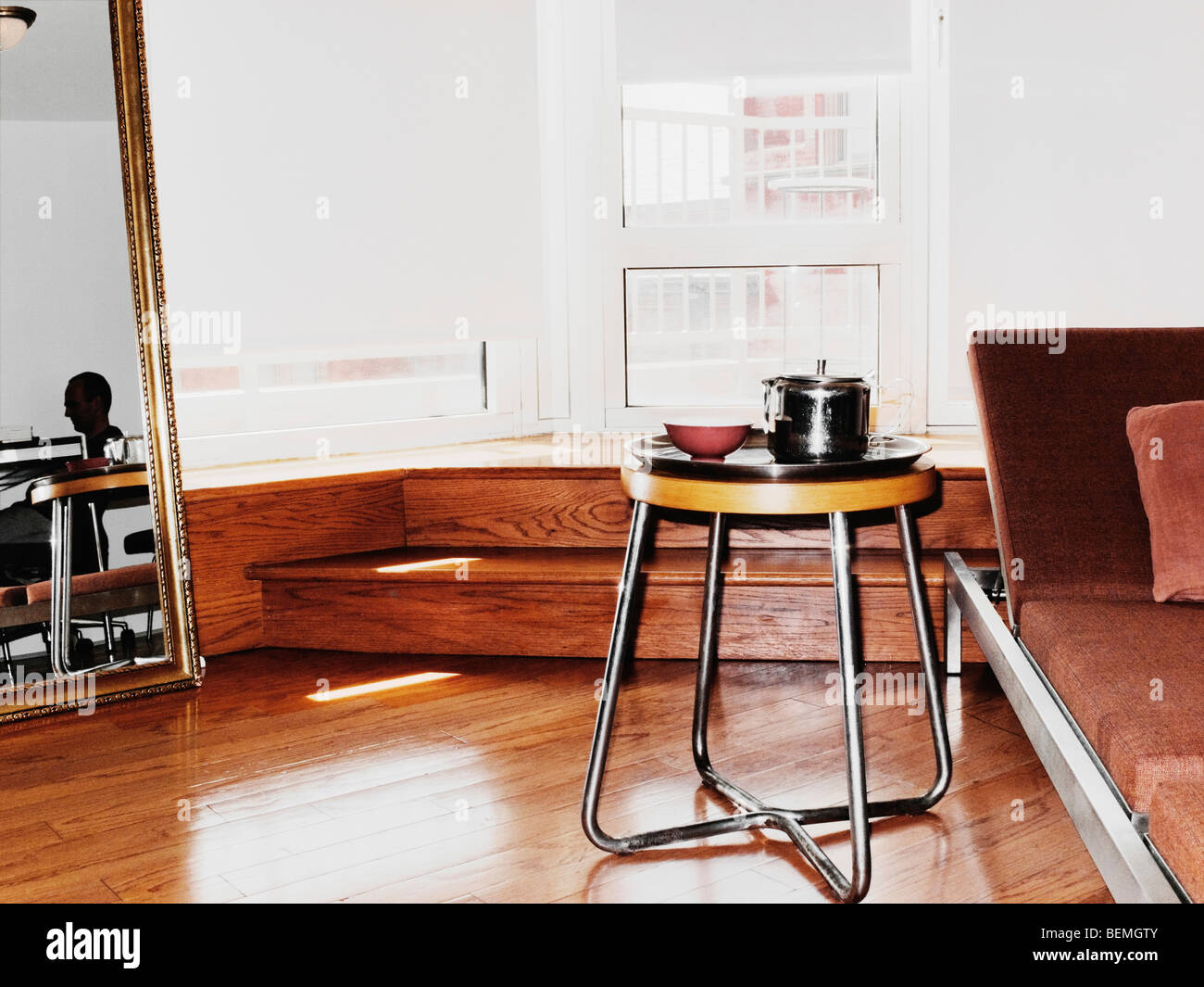 View Of Apartment With Man Working Stock Photo