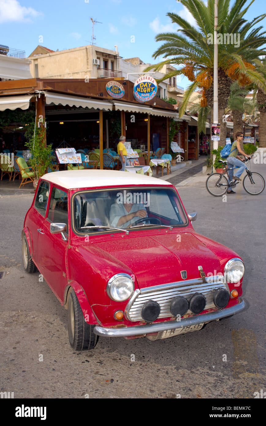 A Red Mini Cooper wth a Union Jack Roof by John Cooper version of the mini  parked on a cobbled street in Huddersfield Stock Photo - Alamy