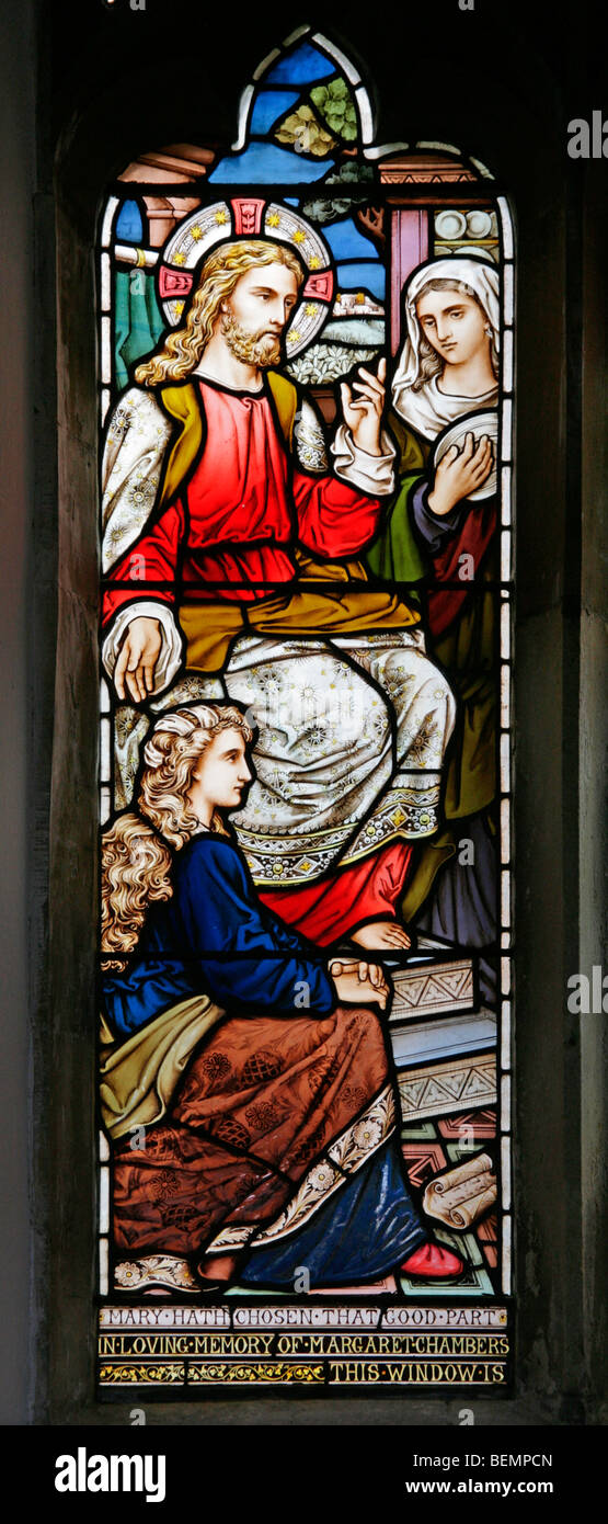 A stained glass window depicting Jesus at the house of Mary and Martha of Bethany, St Edmund's Church, Swanton Novers. Norfolk Stock Photo