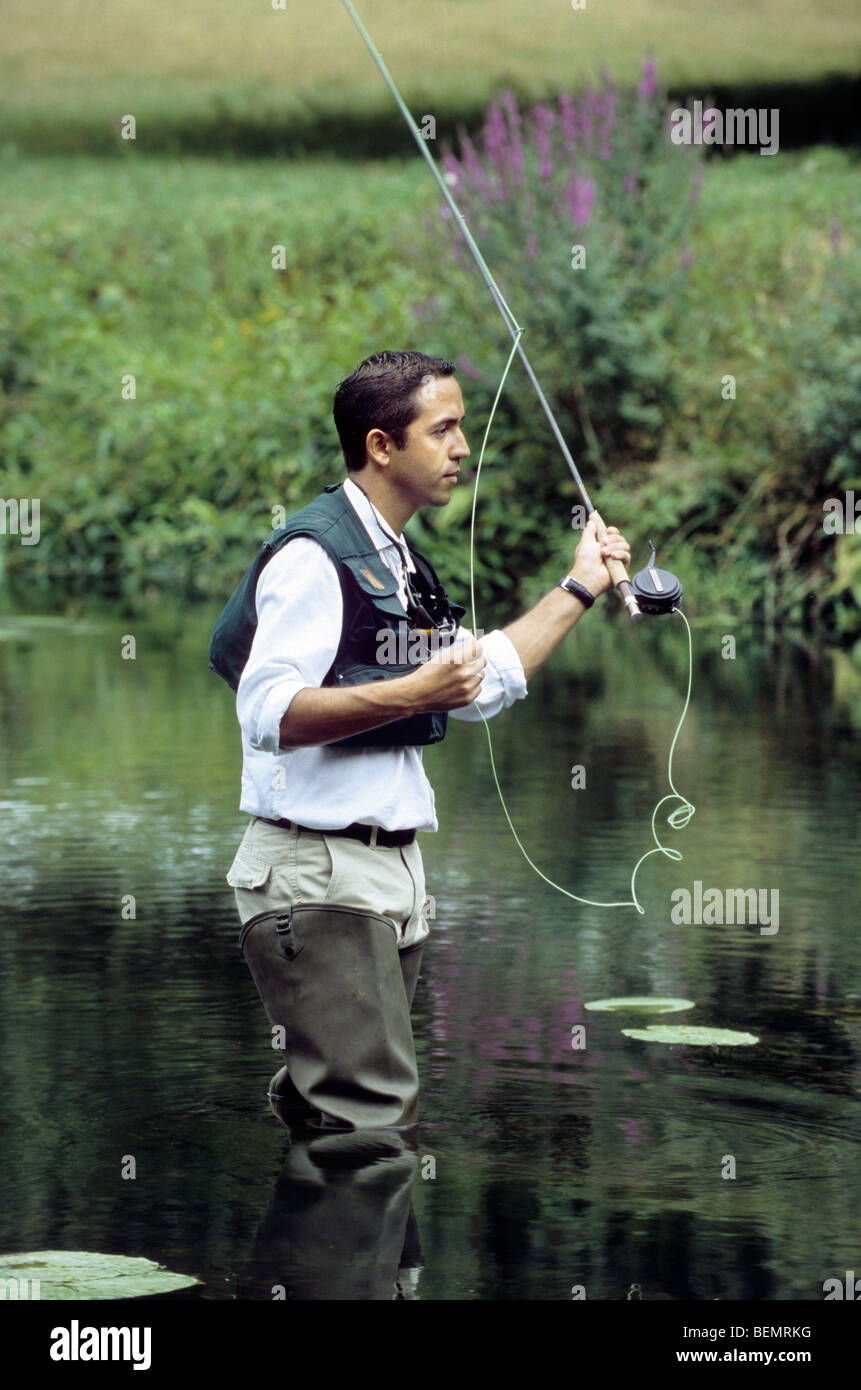 Fly fishing for trout in river, Ardennes, Belgium Stock Photo Alamy