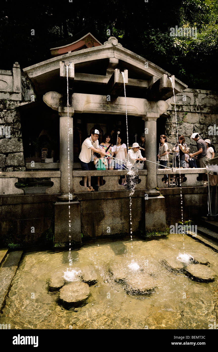 Worshippers drinking water from the Otowanotaki (Otowa waterfall