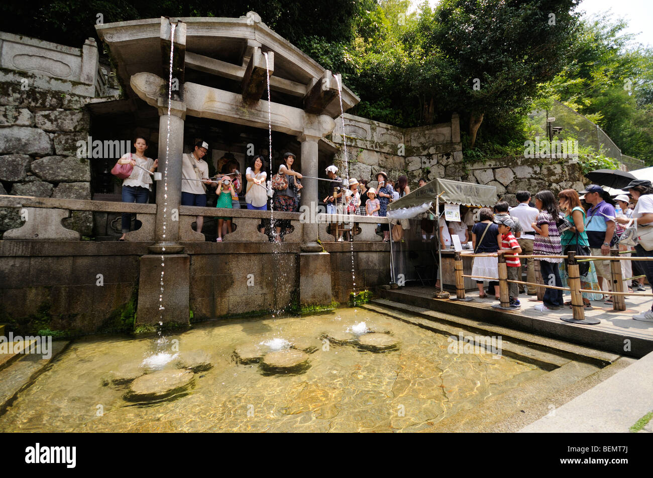 Worshippers drinking water from the Otowanotaki (Otowa waterfall