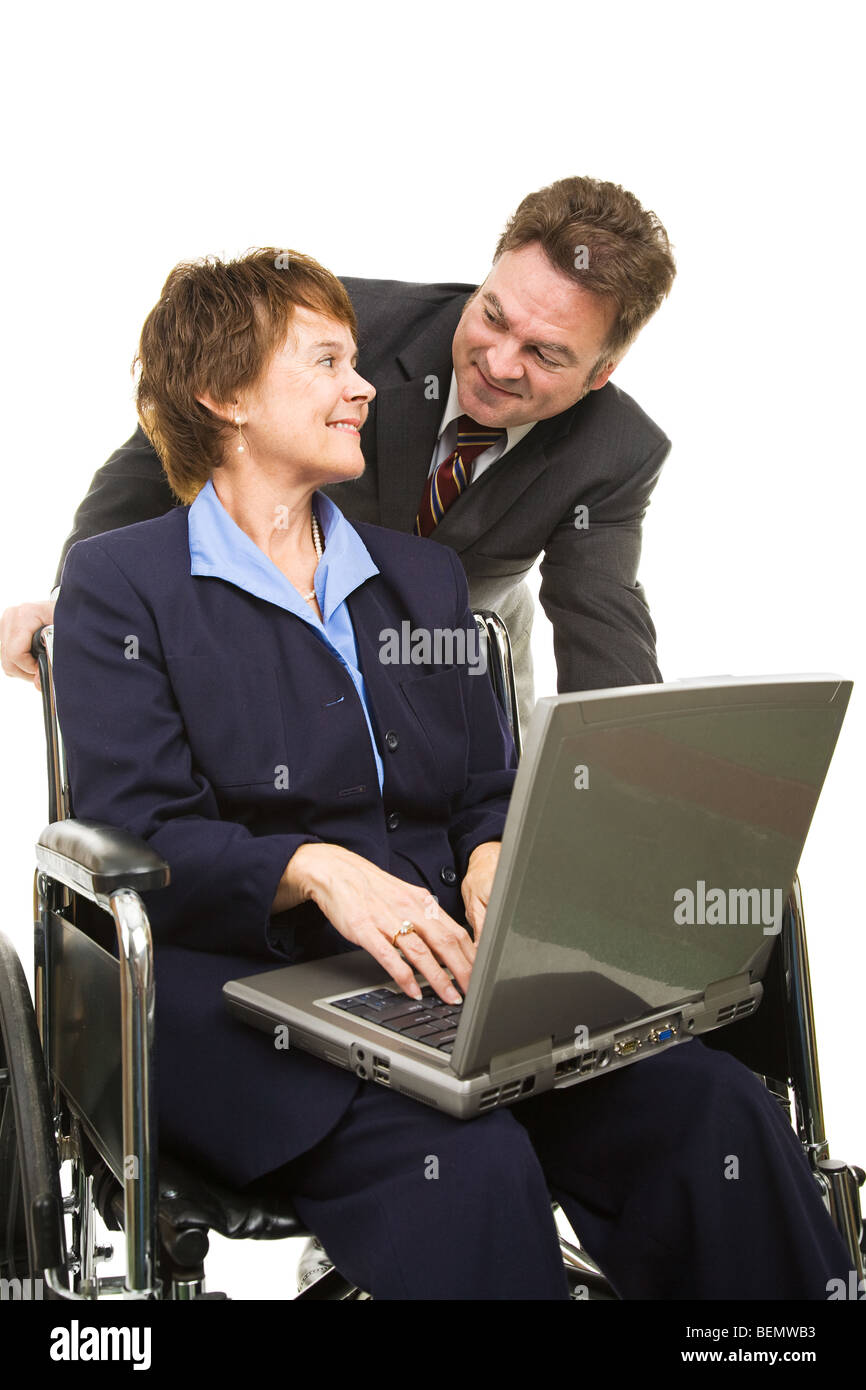 Disabled businesswoman with laptop and her boss having a conversation. Isolated on white. Stock Photo