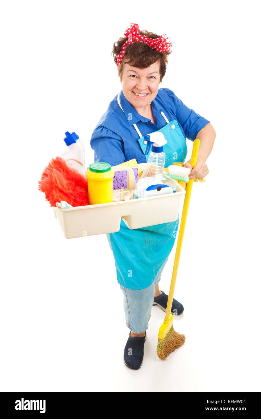 Friendly smiling maid holding a tray of cleaning products. Full body isolated on white. Stock Photo