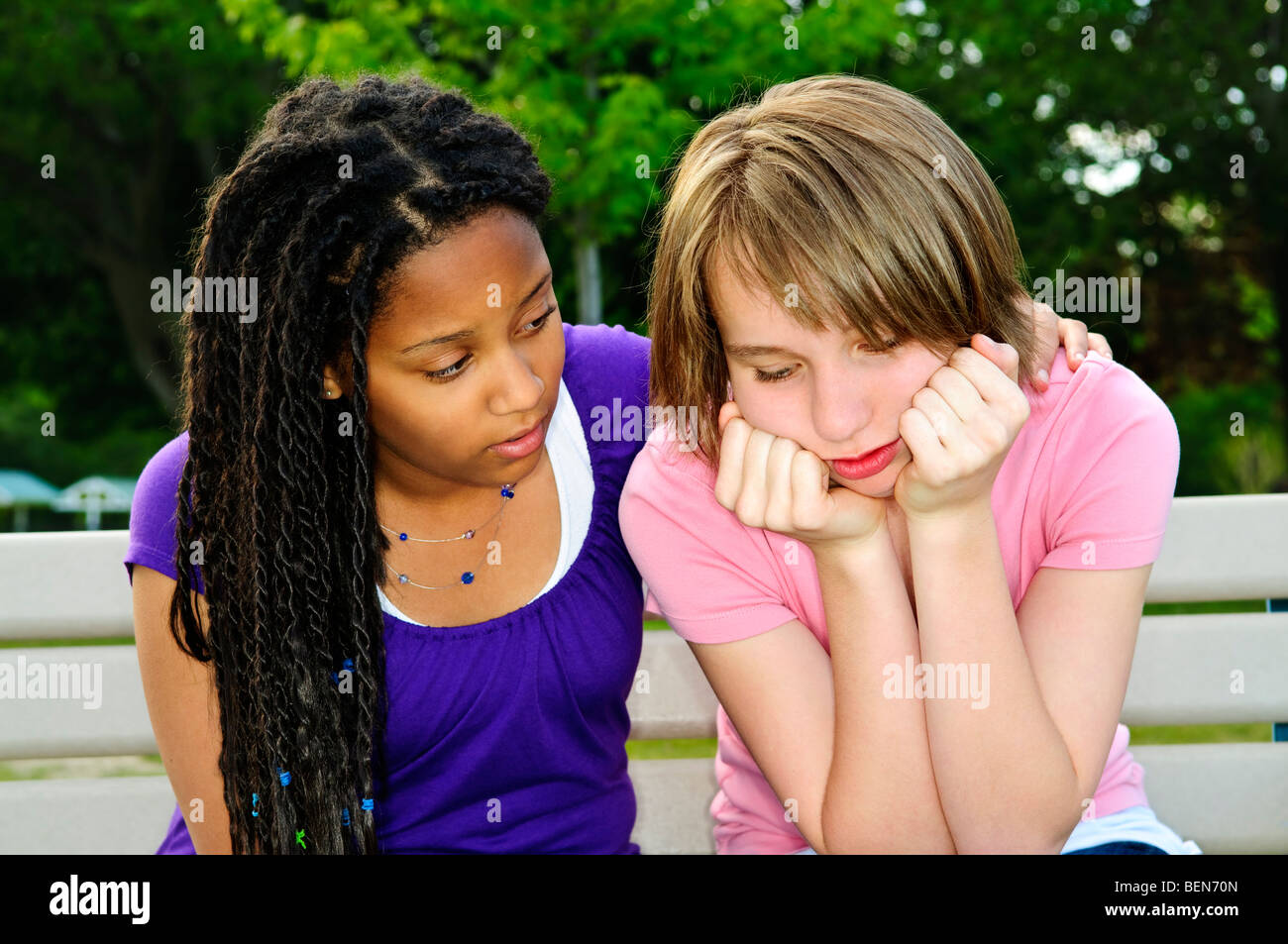 Teenage girl consoling her sad upset friend Stock Photo Alamy