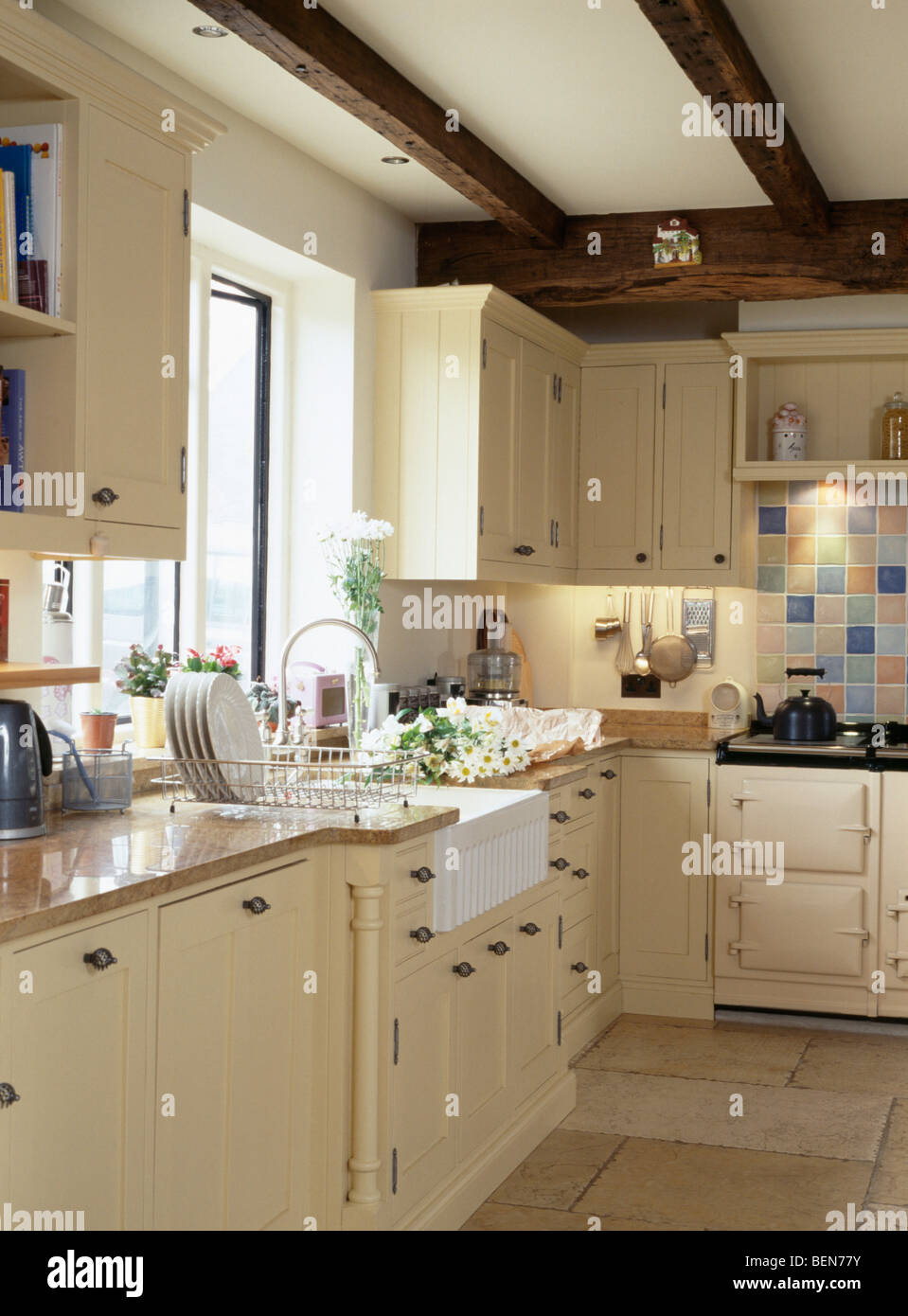 Belfast Sink Below Window In Country Cottage Kitchen With Cream Fitted Units Stock Photo Alamy