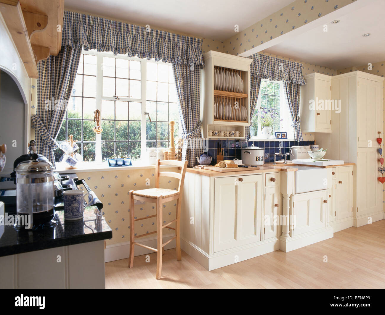 Blue Checked Curtains And Pelmets On Windows In Cream Country Kitchen Stock Photo Alamy