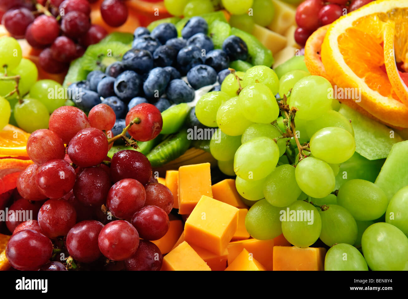 Platter of assorted fresh fruit and cheese Stock Photo Alamy