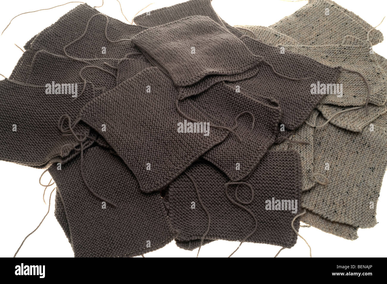 Pile of brown and beige knitted Squares Stock Photo