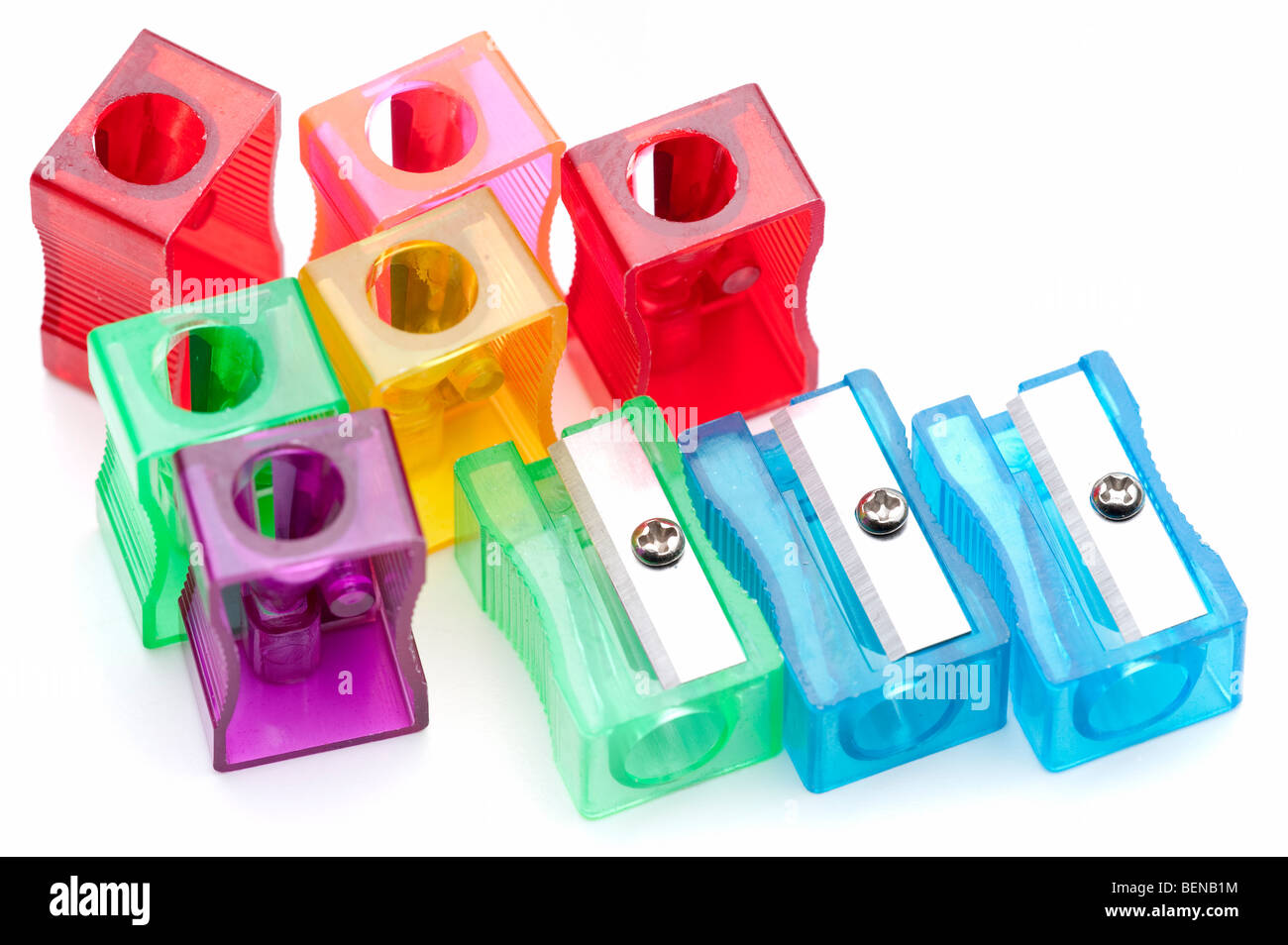 nine multi coloured colored plastic pencil sharpeners Stock Photo