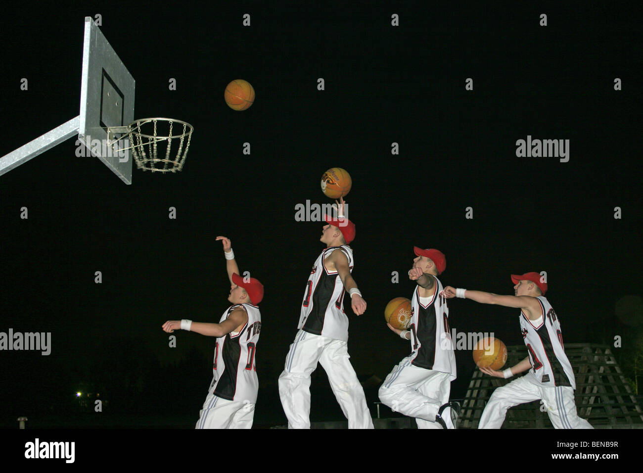 motion sequence of a basketball player throwing the ball into the basket Stock Photo