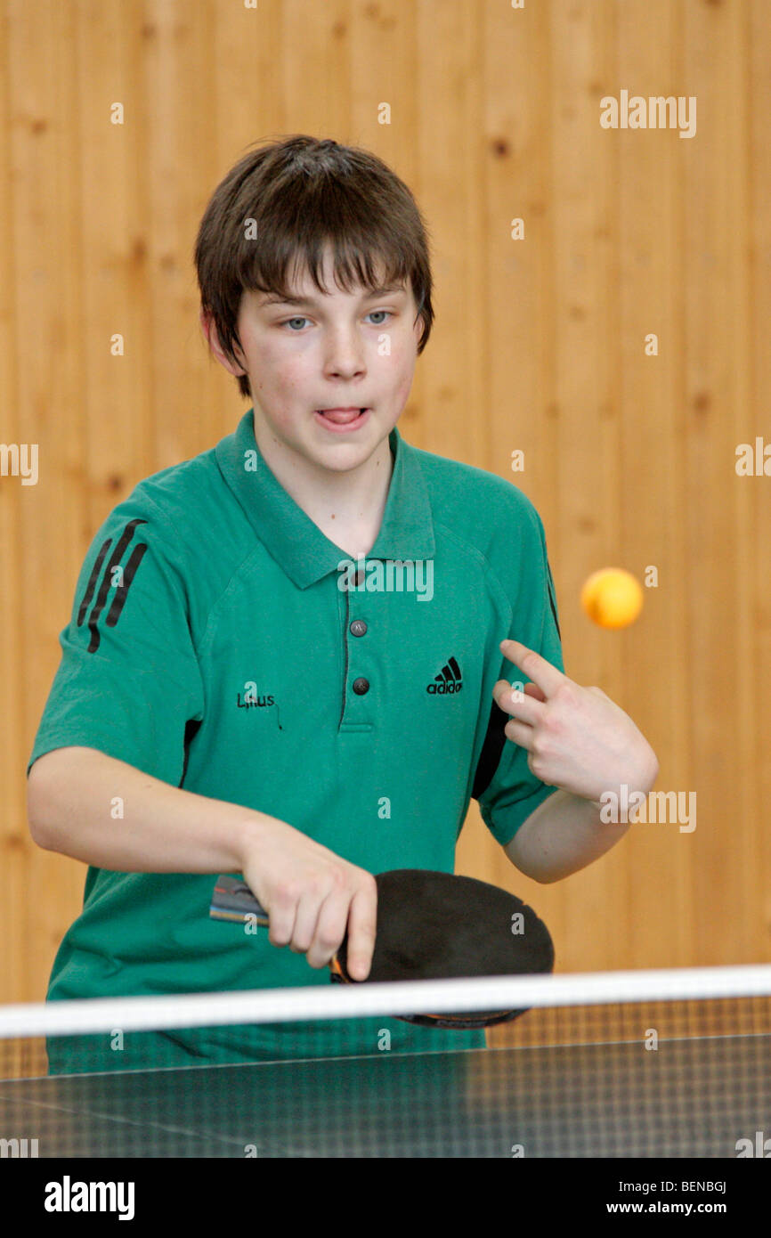young boy playing table tennis Stock Photo