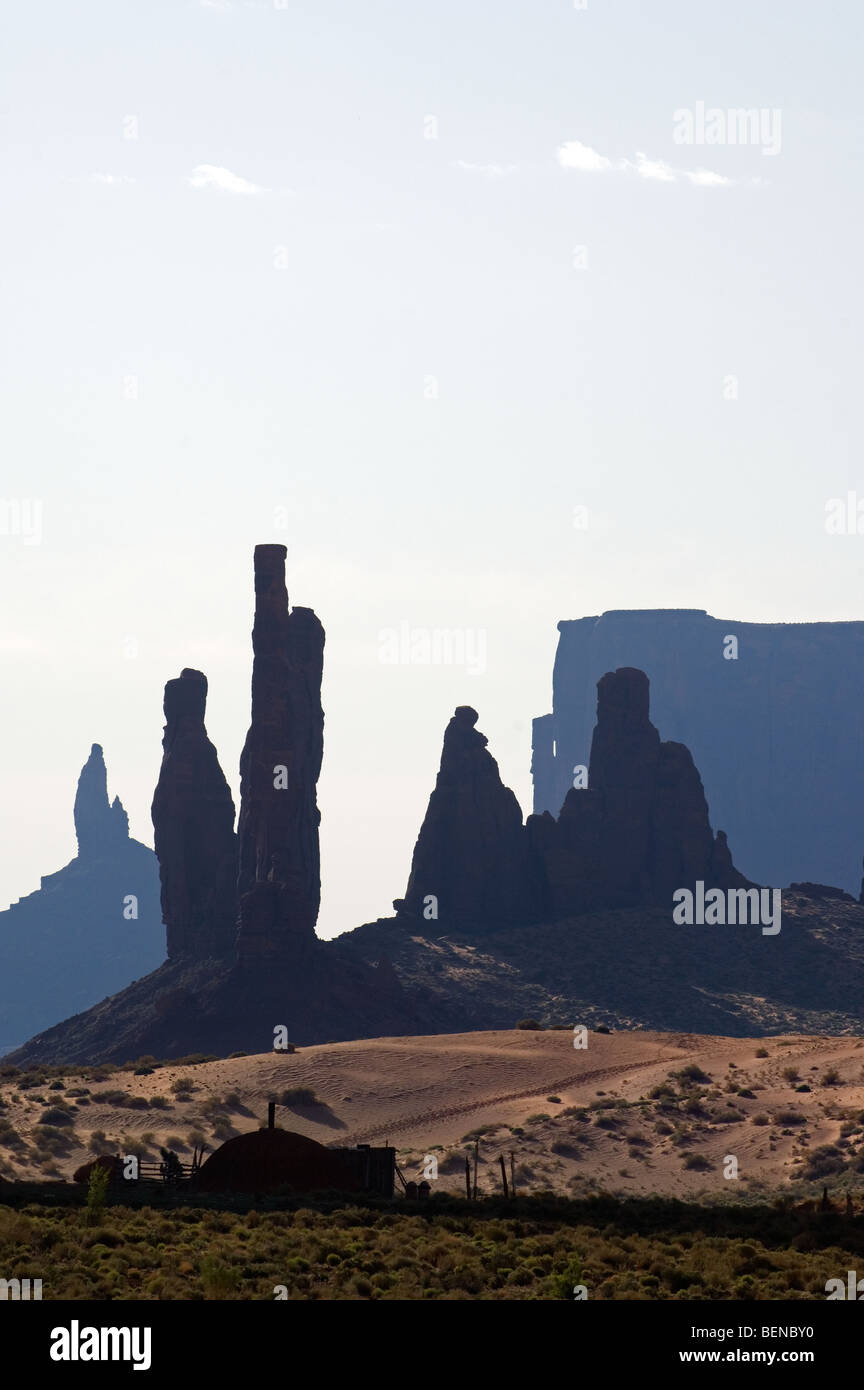 The rock formation Totem Pole with Navajo settlement, Monument Valley