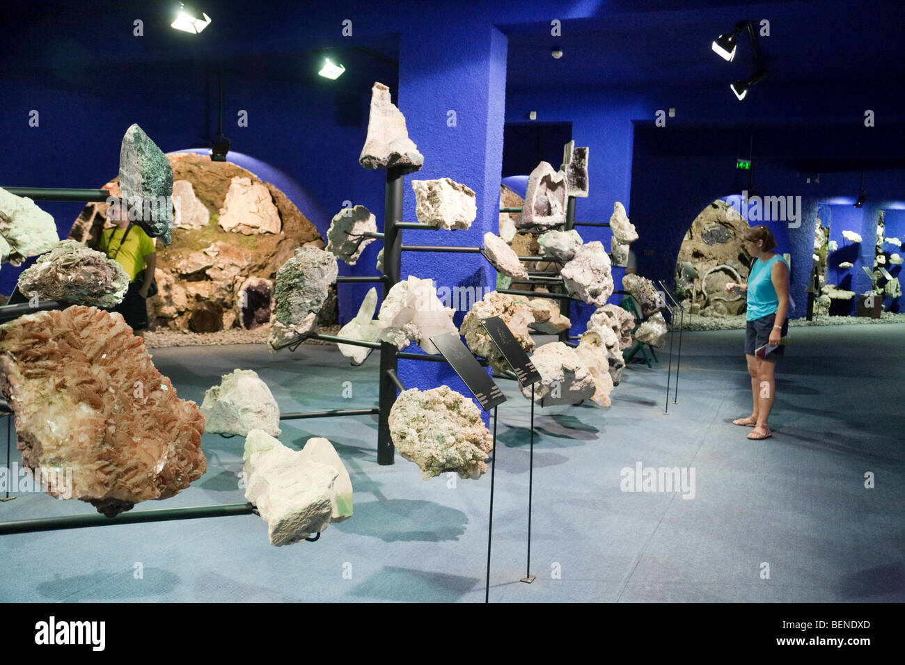 A tourist examines geological specimens, geology museum, Monte Palace