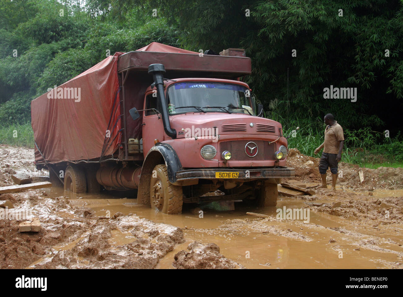 Truck stuck on muddy dirt road in deep mud after rain during the rainy ...