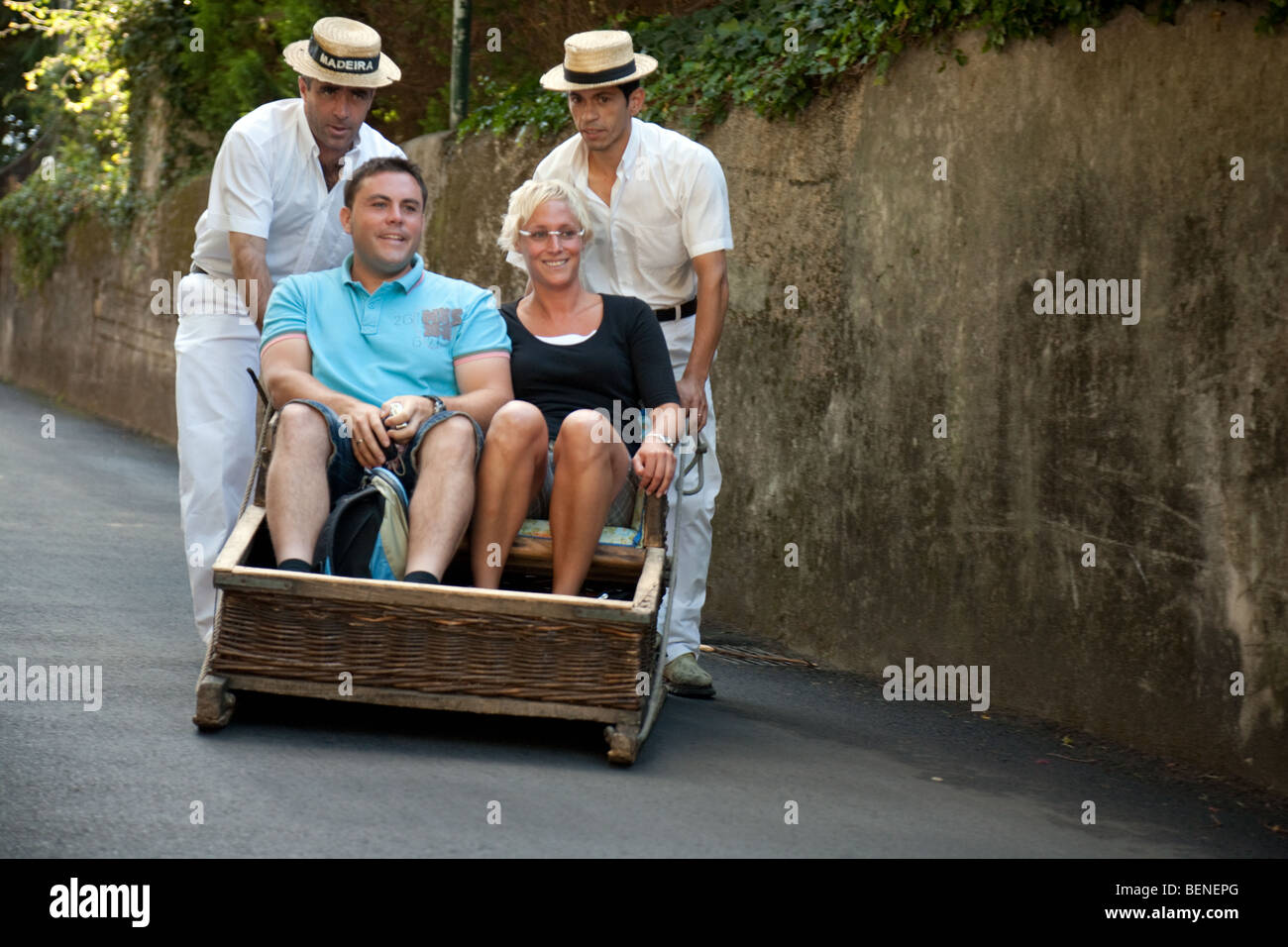 Tourists on the famous street toboggans, Monte, Funchal, madeira Stock Photo